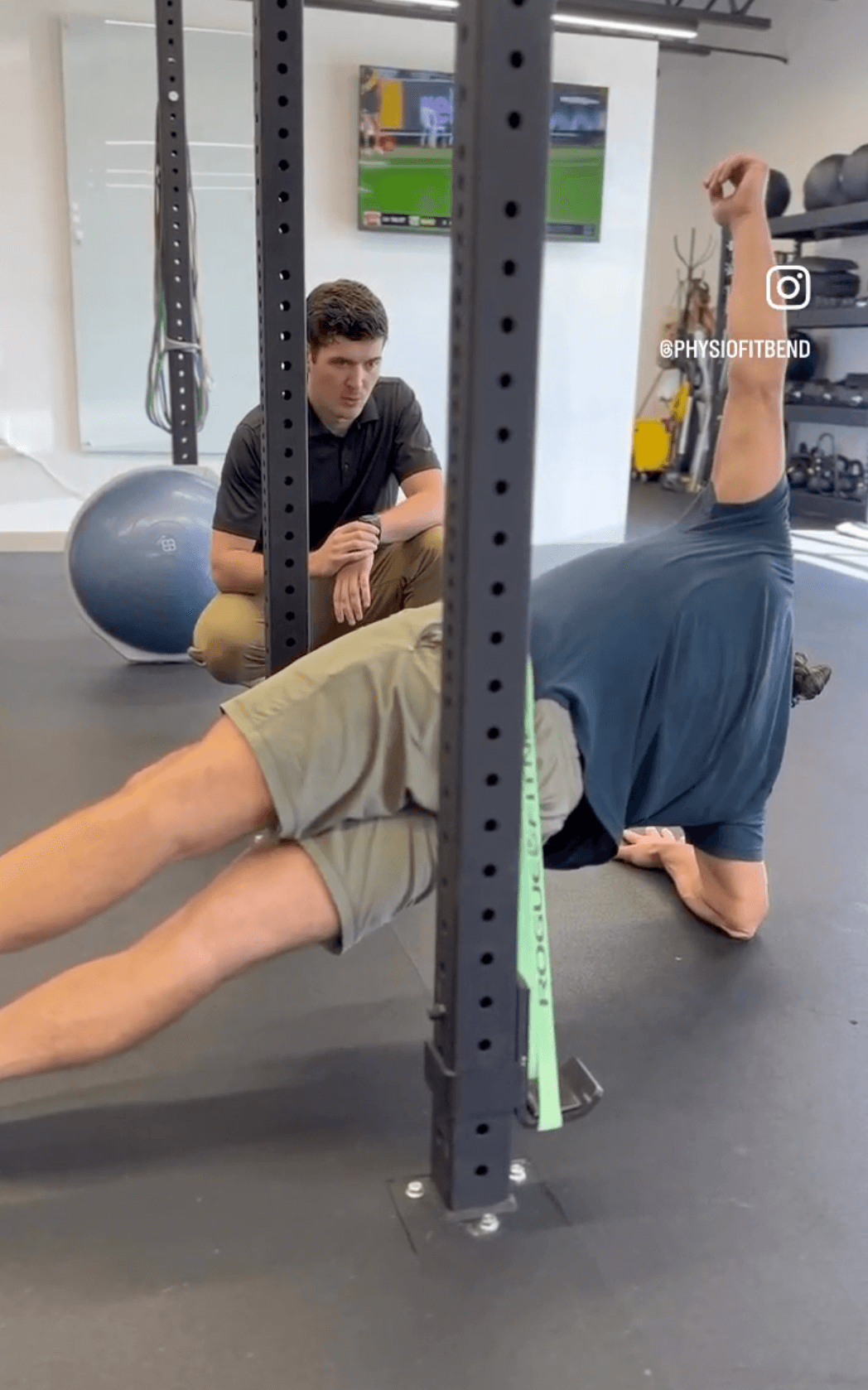 A doctor of physical therapy coaching a patient one-on-one at PhysioFIT in Bend