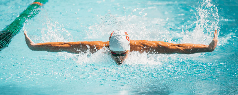 Man swimming laps in a pool.