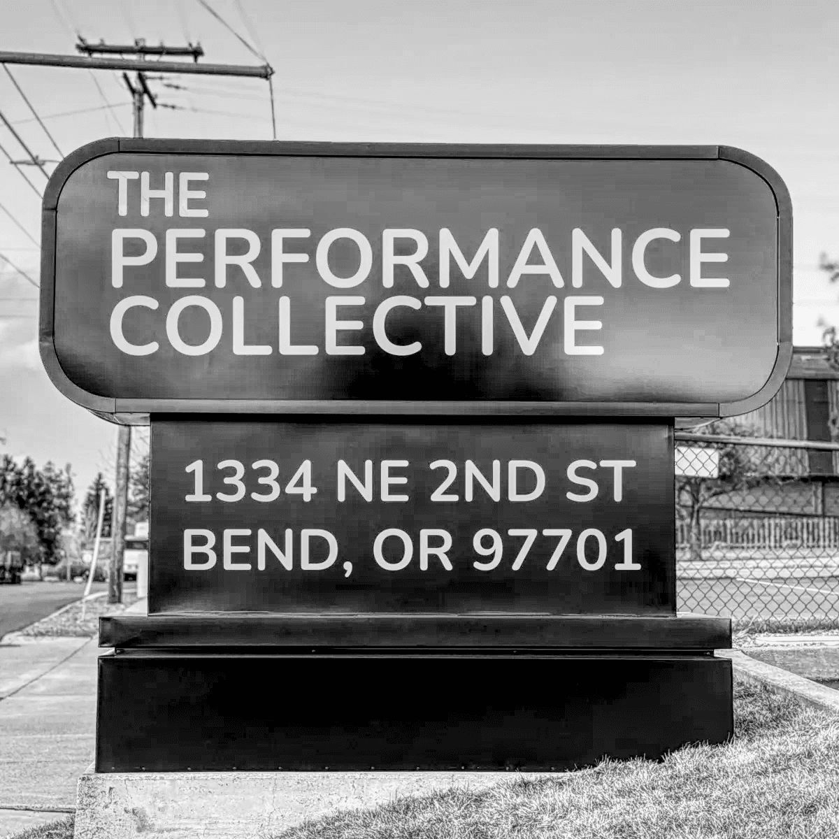 Street sign for The Performance Collective in Bend, Oregon