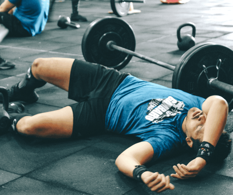 CrossFit athlete lifting under the eye of a physical therapist in Bend, Oregon