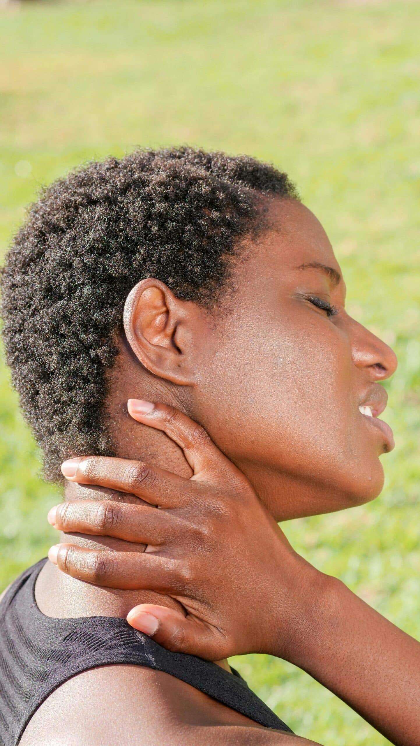 A doctor of physical therapy evaluating a patient's neck pain after a car accident in Bend, Oregon